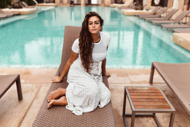 istock woman resting on the pool 1188742964