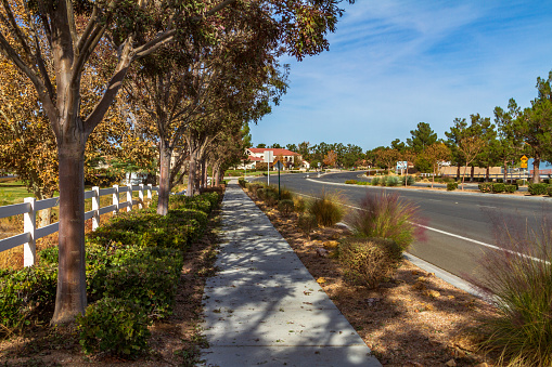 Apple Valley, CA / USA – November 13, 2019: Street view during autumn on Apple Valley Road in the Town of Apple Valley, California.