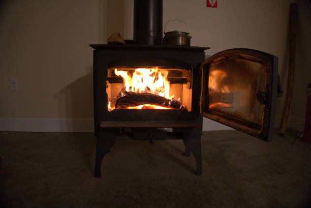 istock Wood stove burning inside.  Alternative heat source and energy source. 1188747417