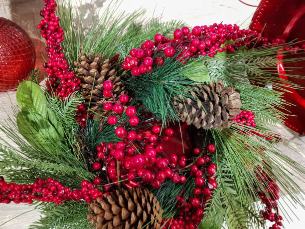 istock Christmas arrangement with christmas tree branches, pine cones and holly berries 1188754476