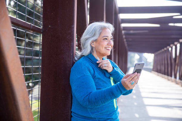 istock Beautiful Woman With Smartphone Getting Ready for Workout 1188758773