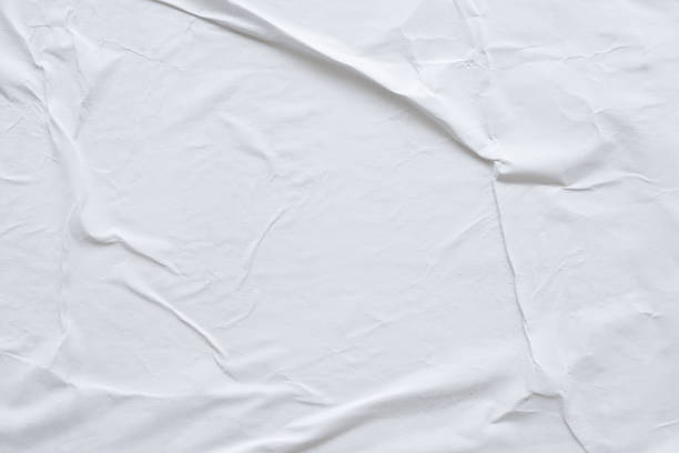 istock Blank white crumpled and creased paper poster texture background 1188759461