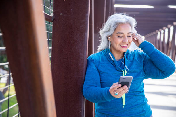 istock Beautiful Woman With Smartphone Getting Ready for Workout 1188761747