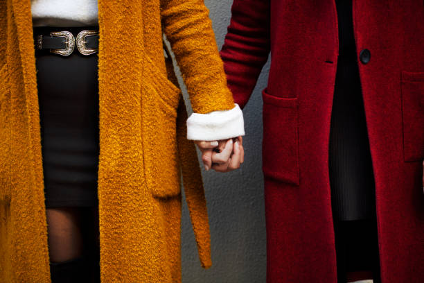istock lesbian couples holding hands, love language, two women 1188765631