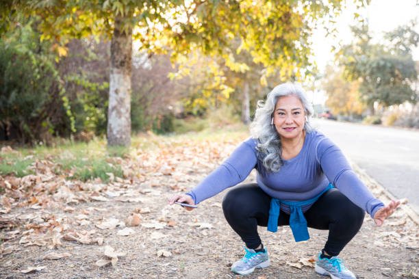 istock Senior Mexican Woman doing Yoga Stretches 1188766095