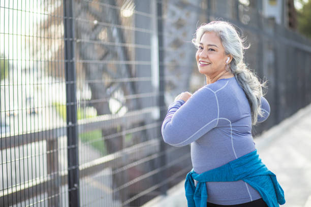 istock Mexican Woman Stretching Back on Urban Bridge 1188766660