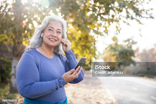 Beautiful Woman With Smartphone Getting Ready For Workout Stock Photo - Download Image Now