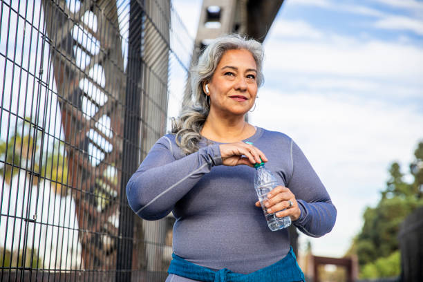 istock Senior Mexican Woman Drinking Water 1188767031