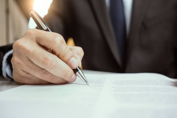 istock Close up business man signing documents or contract 1188773674