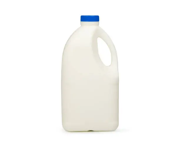 Pasteurized fresh milk in a 1 liter plastic gallon on white background with clipping path.