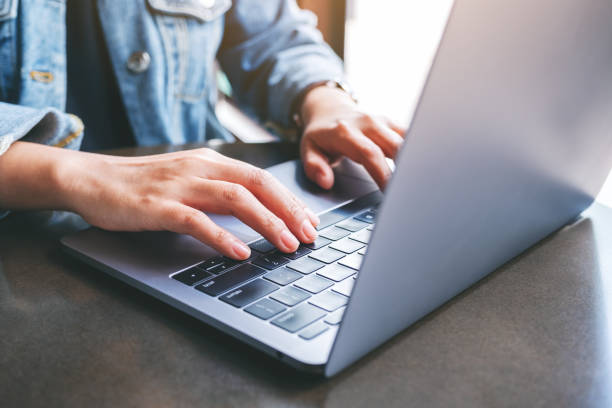 istock a woman working and typing on laptop computer on the table 1188774726