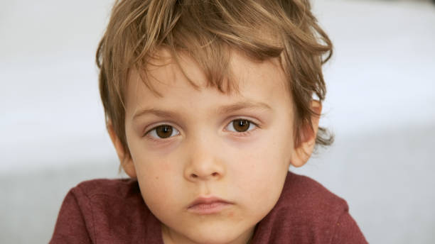 istock Serious little boy looking at the camera 1188775948