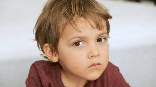 istock Serious little boy looking at the camera 1188775956