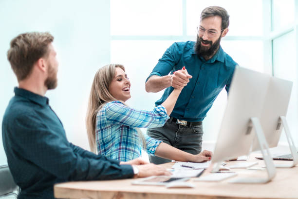 istock business colleagues giving each other a high five 1188779280