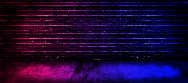 istock Studio dark room with lighting effect red and blue on black brick wall gradient background for interior decoration. 1188786761