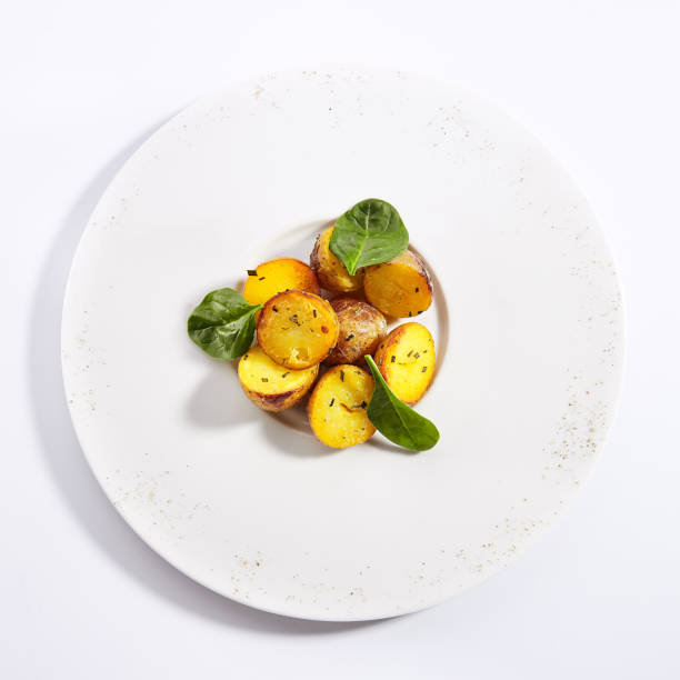 istock Baked potatoes with herbs dish top view 1188792084