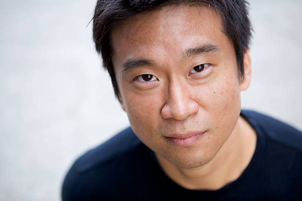 istock Young Asian Man Lookining At the Camera 118879981
