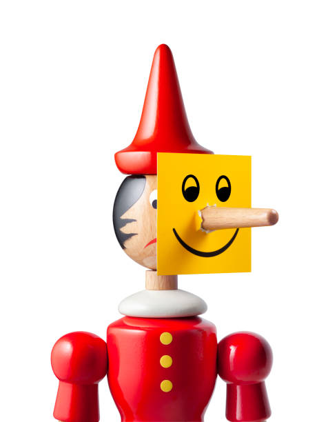 istock Two-faced. Sad Pinocchio with smiley face. Photo with clipping path. 1188802676