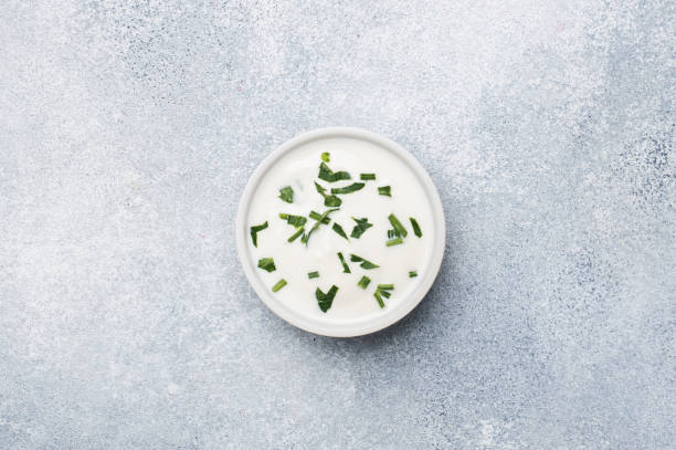 istock mayonnaise greens in plates on a gray concrete table with copy space. 1188803591