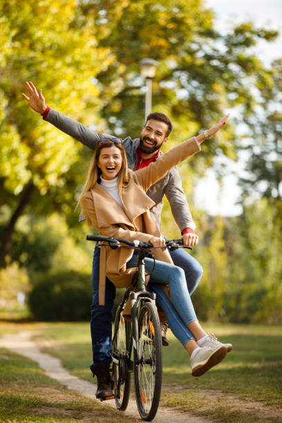 istock Couple enjoying a bicycle ride in the park 1188804459