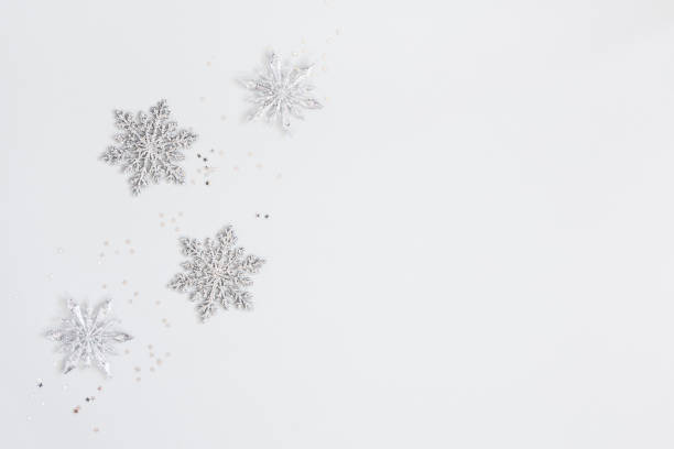 istock Christmas or winter composition. Frame made of silver snowflakes on pastel gray background. Christmas, winter, new year concept. Flat lay, top view, copy space 1188806270