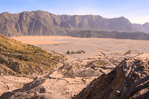 Desert landscape seen from top of the Bromo volcano crater in Indonesia. Seen in the morning in the summer.