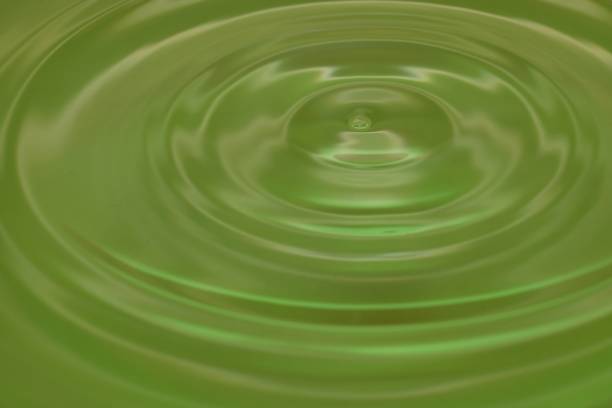 istock green background smooth circles on the water 1188814474