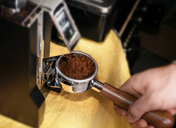 istock Macro shot grinding coffee on professional grinder machine 1188814915