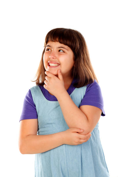 istock Pensive small girl imagining something 1188819407