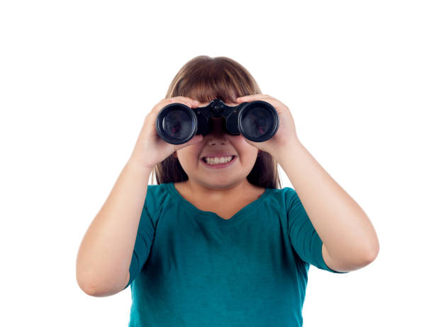 istock Happy girl looking through a binoculars 1188820560