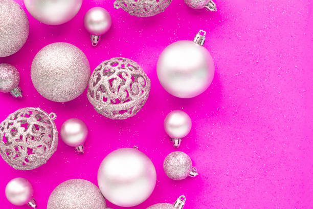 istock Christmas baubles decoration on pink background. 1188820814