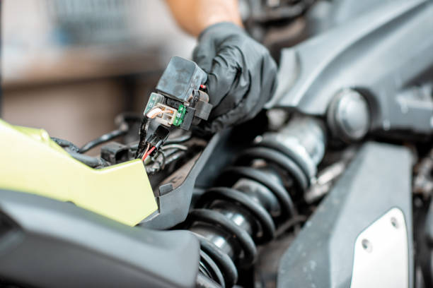 istock Electrician repairing motorcycle wiring 1188820872