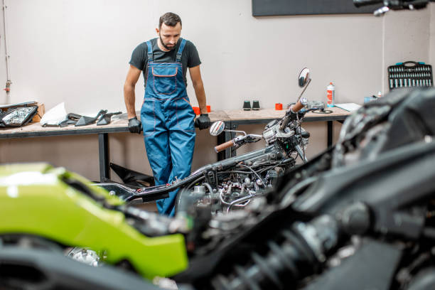 istock Biker with motorcycles in the garage 1188821624