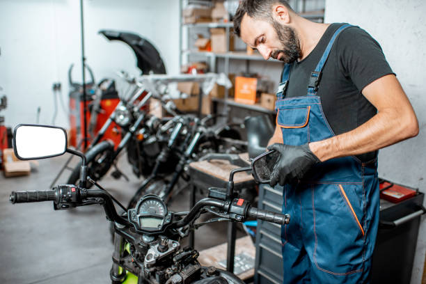 Mechanic repairing or tuning motorcycle