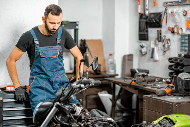 istock Biker with motorcycle in the garage 1188822040