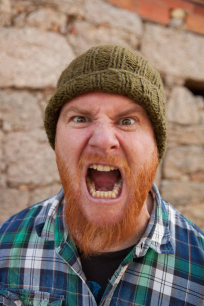 istock Portrait of a hipster guy putting silly face 1188822325