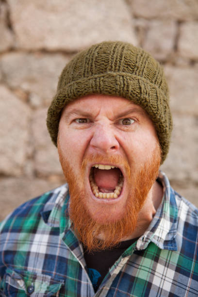 istock Portrait of a hipster guy putting silly face 1188822442