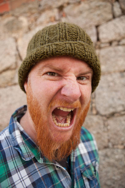 istock Portrait of a hipster guy putting silly face 1188822853