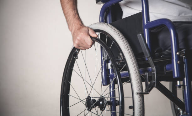 istock Disabled man in wheelchair in home. 1188826644