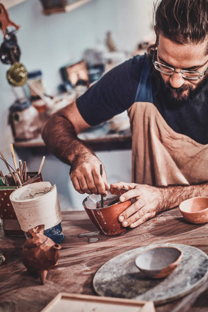 istock Pensive man is working on his big new clay project. 1188827747
