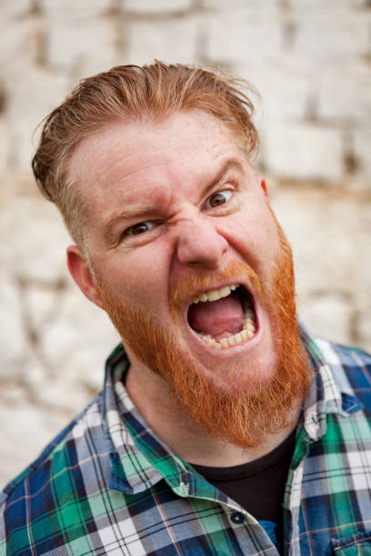istock Portrait of red haired man expressing a emotion 1188828316