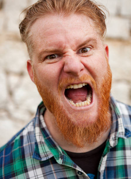istock Portrait of red haired man expressing a emotion 1188828317