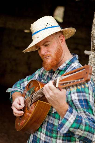 istock Hipster man with red beard playing the guitar 1188828397
