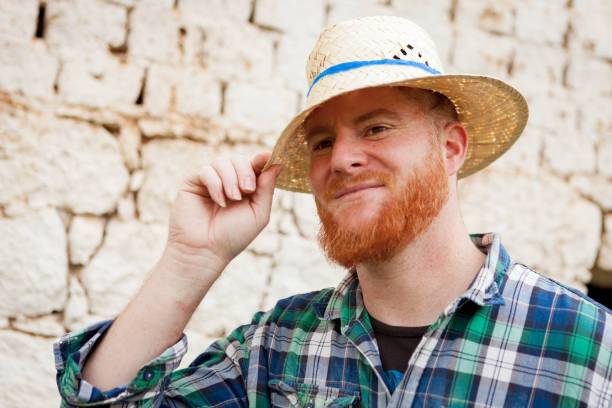 istock Red haired man with a straw hat 1188828460