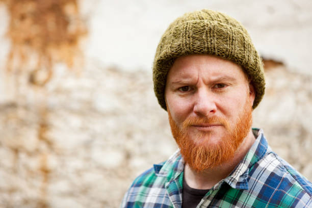 istock Red haired man with plaid shirt looking at camera 1188828548