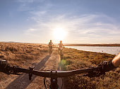 POV of Family Biking Along Shoreline Trail, California, USA