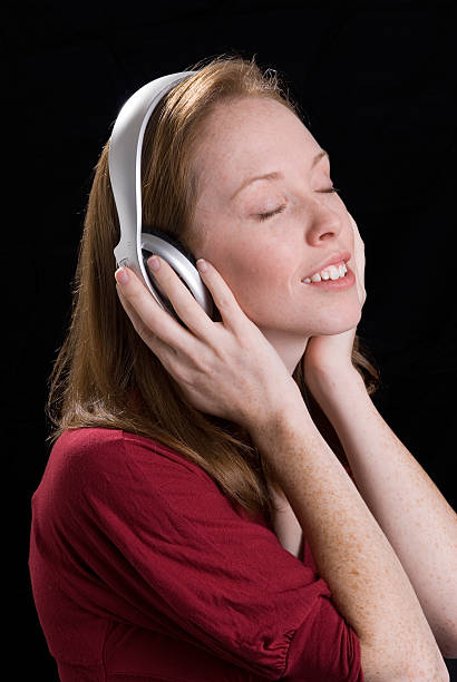 istock woman with headphones-10 118883063