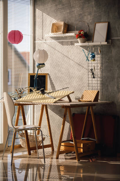 istock Sunlight shining on home office through the window and throwing shade 1188833062
