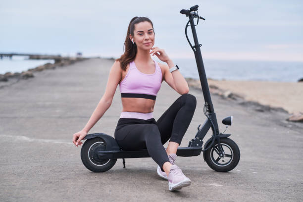 istock Attractive girl is chilling with her scooter 1188837938