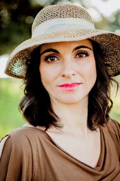 istock Stylish young woman with straw hat 1188838363